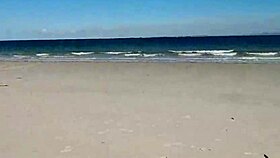 asian slut jj pleasures herself on the sandy beach