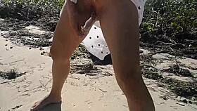 asian slut jj pleasures herself on the sandy beach