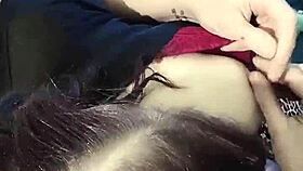 A brunette babe clamps her nipples in close-up detail.