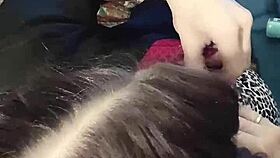 A brunette babe clamps her nipples in close-up detail.