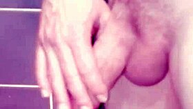 a gay guy jerks off in the bathroom, spanking his ass and cumming hard