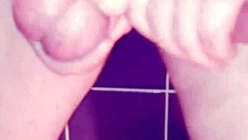 a gay guy jerks off in the bathroom, spanking his ass and cumming hard