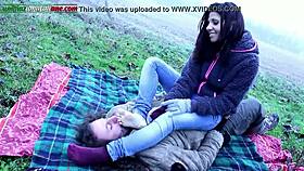 Mistress commands slave to lick feet outdoors in the country