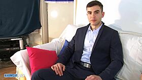 Salesman In Suit Pants Gets His Massive Cock Stroked By Another Man