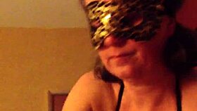 Masked mature woman excitedly sucks off her husband in provocative costume play!