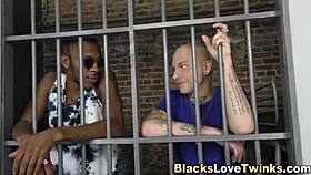 In the prison, a twink eagerly rides a massive black cock, leading to intense blowjobs and anal action.