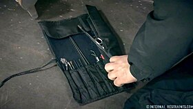 petite brunette endures whipping and bondage with toys in metal restraints