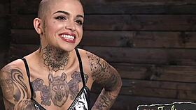 a tattooed babe in stockings uses toys for solo close-up pleasure