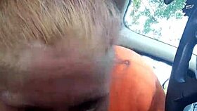 Street whore gives car blowjob with tits and ass exposed.