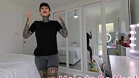 Melody radford tries on metallic dark blue micro bikini at home