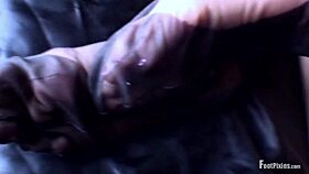 Jade lies horizontal, showcasing her wrinkled toes and shaved legs in a fetish scene.