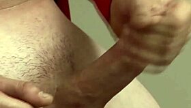 Watch this muscular gay hunk masturbate and cum on the desk?