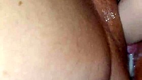 MILF plays with dildo on her pussy close up