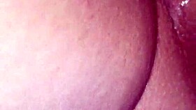 MILF plays with dildo on her pussy close up