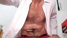 he does a strip tease, ripping off his shirt and panties, showing his huge dick