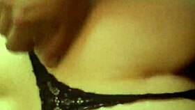 A Latina woman grabs her panties in a playful moment.