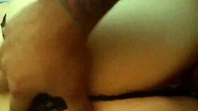 A Latina woman grabs her panties in a playful moment.