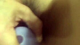 Big purple dildo stretching a tight wet pussy hard