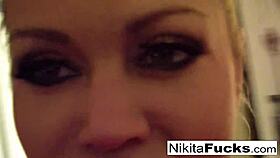 Hot milf Nikita Von James in solo fishnet action, showing her big tits and pussy.