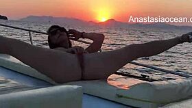 this blondy girl is masturbating naked on the boat party, legs open in public