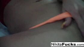 Hot milf Nikita Von James in solo fishnet action, showing her big tits and pussy.