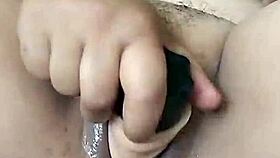 Pornstar Poosoo Uses New Dildo Under Falling Water