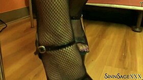 Busty sinn sage teases with her fishnet clad feet