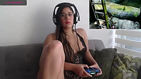 sexy latina plays video game while fingering her petite pussy
