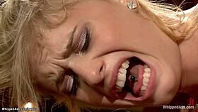 Mistress chokes and whips bound blonde lesbian slave during deepthroat