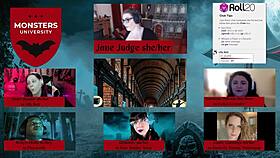 i'm roleplaying as a monster at university with cassie cummings and others on the desk