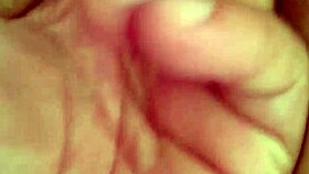 She's fingering her wet pussy during an intense masturbation session