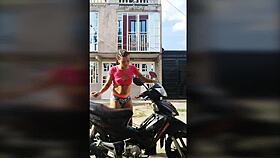 Is TS Angelique Monroe washing her bike outdoors?