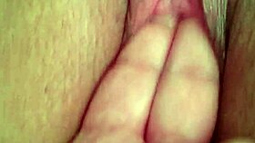 She's fingering her wet pussy during an intense masturbation session