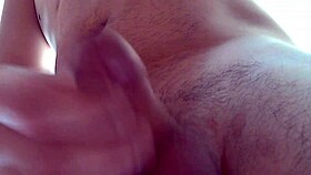 Man jerks off and shoots cum close up.