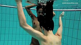 nina and zlata enjoying underwater fun in the pool