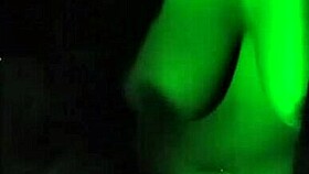 Morena performs strip-tease in dark room with clothes ripped