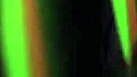 Morena performs strip-tease in dark room with clothes ripped