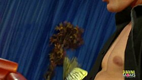 Blonde cutie in red dress relaxes on sofa