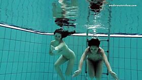 nina and zlata enjoying underwater fun in the pool