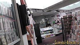 a blonde milf with big tits sucks a big cock through a gloryhole and swallows cum