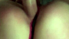 this redhead is playing with a monster cock in the bedroom.