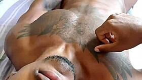 Black guy jerks off his cock in a casual blowjob scene