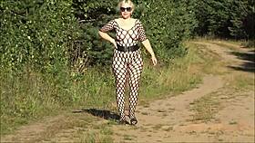 Lady Redrose strips naked in her bodystocking outdoors, showing off her ass.