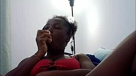 Watch this freaky ebony brunette shake her big ass while fucking pussy with dildo in socks