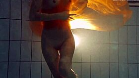 nastya strips down and shows her naked body in the pool