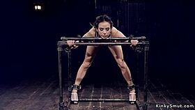 submissive in backbend and body clamp bondage endures rough play