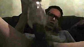 Intense gay play with toy in bold action.