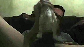 Intense gay play with toy in bold action.