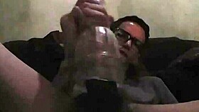 Intense gay play with toy in bold action.