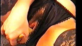 Alicia enjoys a banana in the kitchen while masturbating as a housewife